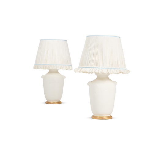 158 - A PAIR OF WHITE GLAZED POTTERY VASE LAMPS MODERNWith mask handles, now mounted and wired as lamp76cm... 