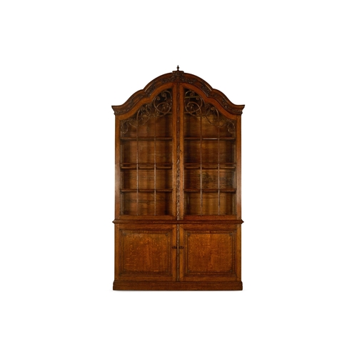 16 - AN OAK DISPLAY CABINETDUTCH, LATE 18TH/EARLY 19TH CENTURYThe arched top surmounted by an urn draped ... 