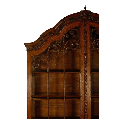 16 - AN OAK DISPLAY CABINETDUTCH, LATE 18TH/EARLY 19TH CENTURYThe arched top surmounted by an urn draped ... 