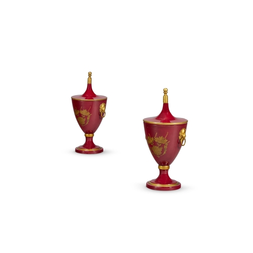 168 - A PAIR OF RED AND GILT TOLE LIDDED CHESNUT URNS MODERN, IN THE GEORGE III STYLEWith lion head handle... 