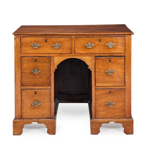 230A - A SMALL WALNUT KNEEHOLE DESK IN THE WILLIAM AND MARY STYLE19TH CENTURYWith two drawer above a pair o... 