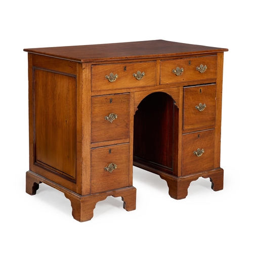 230A - A SMALL WALNUT KNEEHOLE DESK IN THE WILLIAM AND MARY STYLE19TH CENTURYWith two drawer above a pair o... 