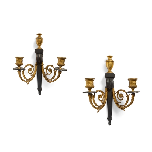 245 - A PAIR OF REGENCY BRONZE AND ORMOLU TWIN BRANCH WALL APPLIQUES EARLY 19TH CENTURY  32cm high, 22cm w... 