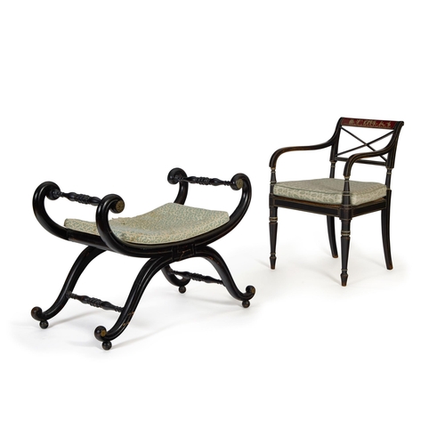 283 - A REGENCY LATER BLACK PAINTED OPEN ARMCHAIREARLY 19TH CENTURY With an X-splat, squab cushion and can... 