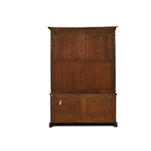 30 - A GEORGE III MAHOGANY BOOKCASE18TH CENTURY AND LATER With two replaced glazed doors hung with fabric... 