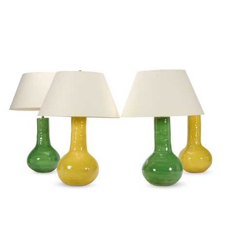 46 - FOUR GLAZED POTTERY LAMPSMODERNOne pair green, the other yellowThe yellow pair 75cm high overall, th... 