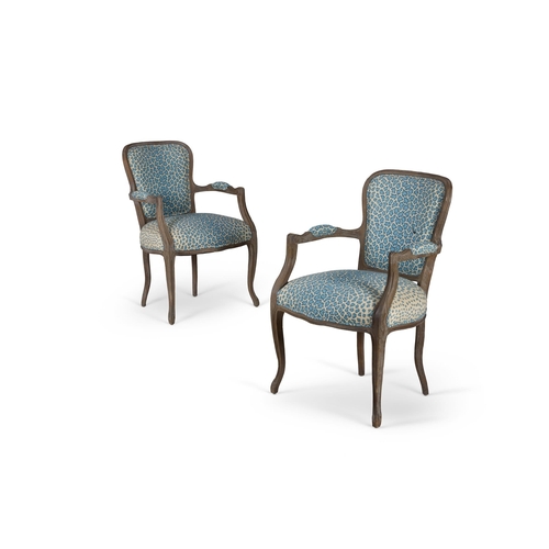 84 - A PAIR OF HARDWOOD OPEN ARMCHAIRSLATE 20TH CENTURY, IN LOUIS XV STYLE Upholstered in Sibyl Colefax &... 