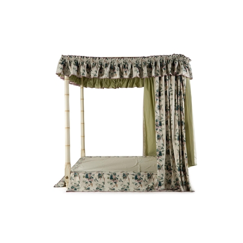 99 - A CREAM PAINTED, SIMULATED BAMBOO FOUR POSTER BEDBY SIBYL COLEFAX & JOHN FOWLERDressed with green 'L... 