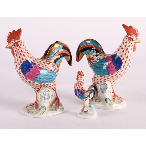 54 - A PAIR OF HEREND MODELS OF ROOSTERS, AND ANOTHER SMALLER EXAMPLE20TH CENTURYEach cock 14cm high, 12c... 