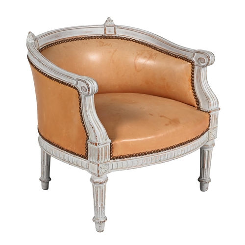 163 - A WHITE PAINTED AND LEATHER UPHOLSTERED BOUDOIR CHAIR IN LOUIS XVI STYLE, LATE 19TH OR EARLY 20TH CE... 