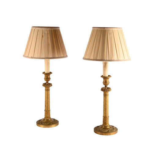 197 - A PAIR OF GILT METAL CANDLESTICK LAMP BASES19TH CENTURY later converted 47cm high, 14cm diameter