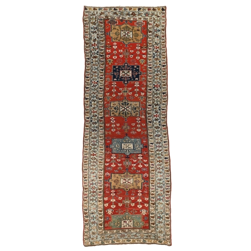 208 - A CAUCASIAN RUNNERapproximately 350cm x 109cm