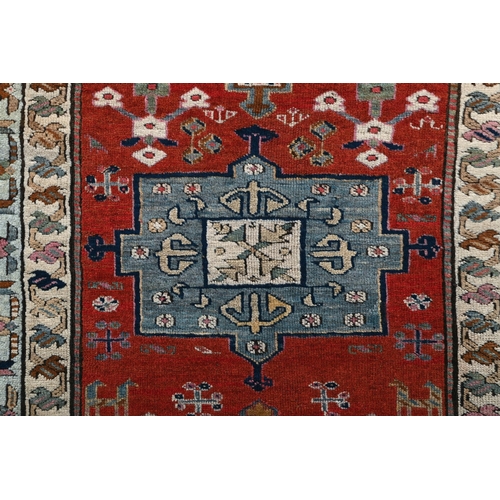 208 - A CAUCASIAN RUNNERapproximately 350cm x 109cm