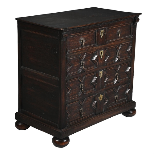 226 - A CHARLES II OAK MITRE MOULDED CHEST OF DRAWERSCIRCA 1690With arrangement of drawers, on bun feet93c... 