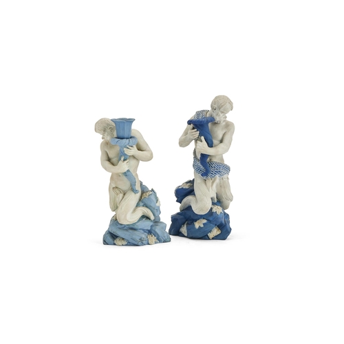 236 - TWO WEDGWOOD BLUE JASPER FIGURAL CANDLESTICKS LATE 18TH OR 19TH CENTURY Each modelled as a triton ho... 