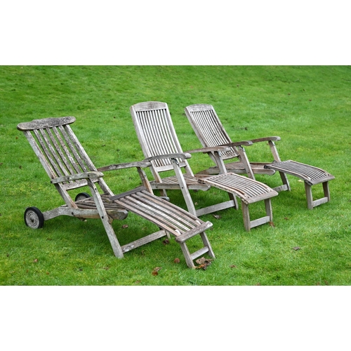 357 - THREE TEAK LOUNGERSOF RECENT MANUFACTUREComprising a matching pair and one similar with wheels74cm h... 