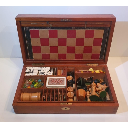 101 - A VERY GOOD 19TH CENTURY MAHOGANY GAMES BOX, which contains board games, chess and draughts pieces, ... 