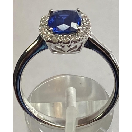 103 - AN 18CT WHITE GOLD CUSHION CUT CEYLON SAPPHIRE AND DIAMOND CLUSTER RING, with central sapphire stone... 