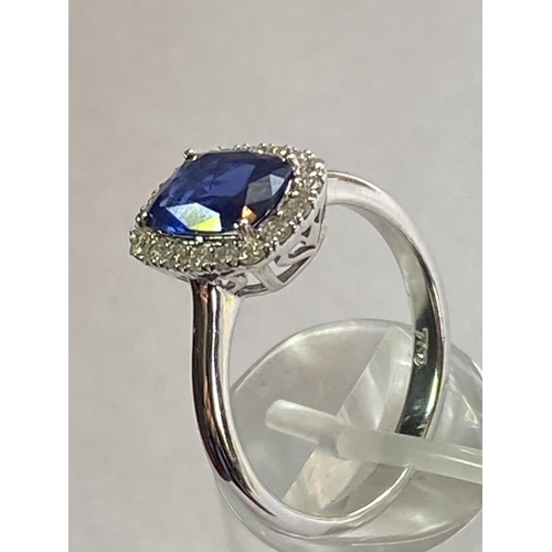 103 - AN 18CT WHITE GOLD CUSHION CUT CEYLON SAPPHIRE AND DIAMOND CLUSTER RING, with central sapphire stone... 