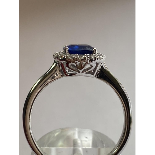 103 - AN 18CT WHITE GOLD CUSHION CUT CEYLON SAPPHIRE AND DIAMOND CLUSTER RING, with central sapphire stone... 