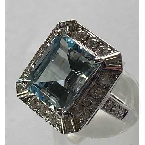 104 - A MAGNIFICENT 18CT WHITE GOLD AQUAMARINE AND DIAMOND CLUSTER RING, with the central aquamarine stone... 