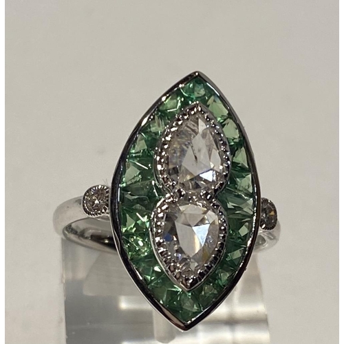 105 - A BEAUTIFUL 18CT WHITE GOLD ART DECO STYLE PERIDOT AND DIAMOND RING, with two central pear shaped di... 