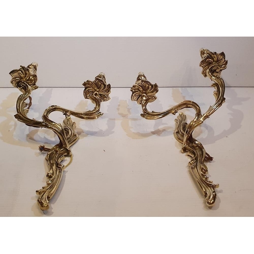 106 - A PAIR OF POLISHED BRASS 19TH CENTURY CAST BRASS CANDLEABRA STYLE WALL SCONCES, electrified, 43.2cm ... 