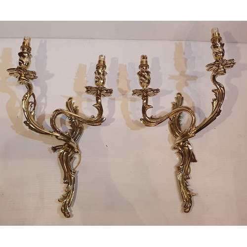 106 - A PAIR OF POLISHED BRASS 19TH CENTURY CAST BRASS CANDLEABRA STYLE WALL SCONCES, electrified, 43.2cm ... 