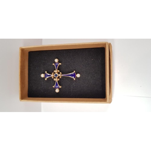 110 - A 14CT YELLOW GOLD FRANKLIN MINT MIDNIGHT SAPPHIRE CROSS PENDANT with central sapphire stone, a smal... 