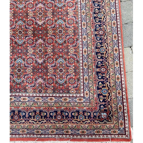 130 - A GOOD BIDJAR FLOOR RUG with main rust and blue colours, multiple borders of various colours and mot... 