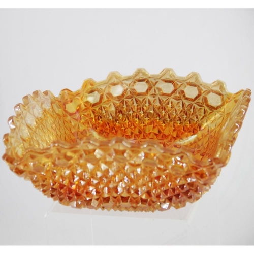 138 - AN EARLY 20TH CENTURY CARNIVAL GLASS BOWL, in orange/camber colour, square in shape, 23cm across app... 