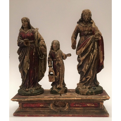 140 - AN ANTIQUE CARVED WOODEN ORNAMENT OF THE HOLY FAMILY, 34 x 37 x 10cm approx.