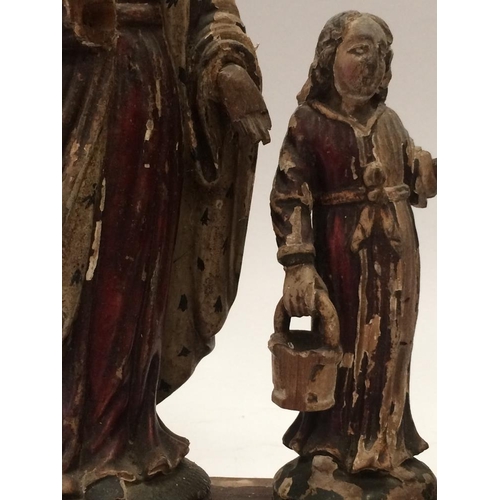 140 - AN ANTIQUE CARVED WOODEN ORNAMENT OF THE HOLY FAMILY, 34 x 37 x 10cm approx.