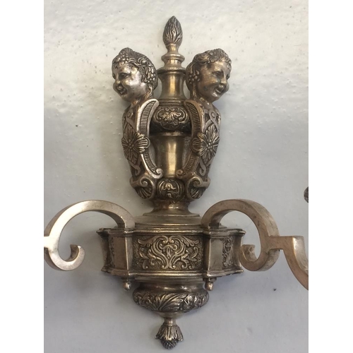 141 - A PAIR OF SILVER PLATED HEAVY CAST CANDELABRA SCONCE, decorated with floral and foliage motif and a ... 