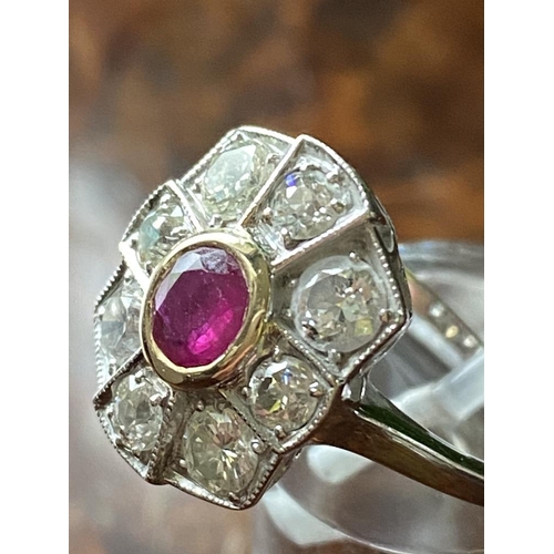 154 - AN 18CT WHITE GOLD VINTAGE BURMESE RUBY AND DIAMOND CLUSTER RING, .80ct ruby surrounded by 1.35cts o... 