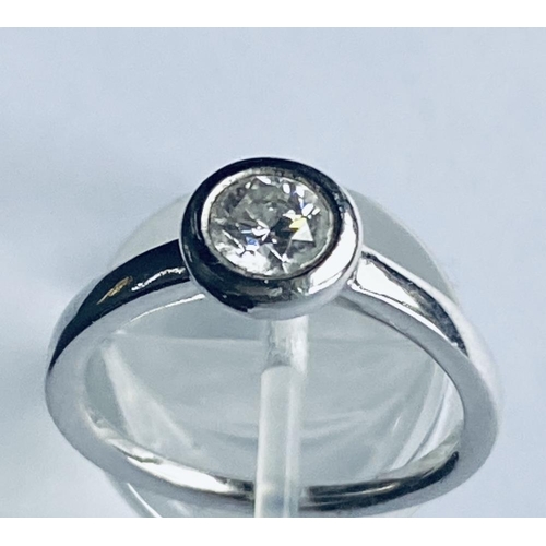 155 - A PLATINUM RUB OVER DIAMOND SOLITAIRE RING, total diamond weight: .65cts, colour G, clarity VS1, rin... 