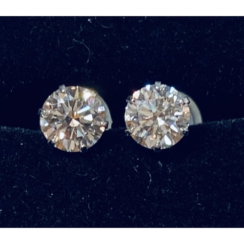 156 - A PAIR OF 18CT WHITE GOLD FOUR CLAW SET DIAMOND STUD EARRINGS, total diamond weight: .80cts, colour ... 