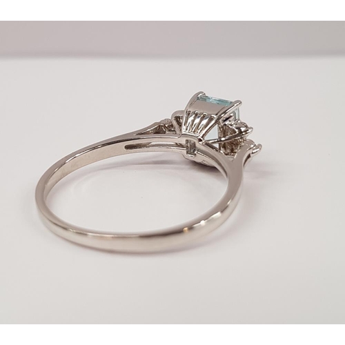 164 - A STUNNING 14CT WHITE GOLD AQUAMARINE AND DIAMOND RING, with central Aquamarine stone, and 3 diamond... 