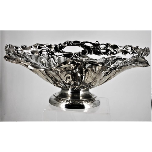 182 - AN EARLY 20TH CENTURY SILVER PLATED FRUIT BOWL, with dense foliage design and swing handle