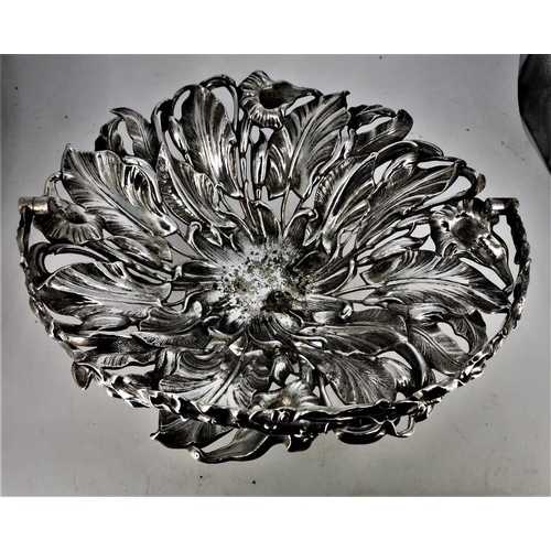 182 - AN EARLY 20TH CENTURY SILVER PLATED FRUIT BOWL, with dense foliage design and swing handle