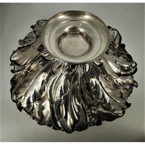 182 - AN EARLY 20TH CENTURY SILVER PLATED FRUIT BOWL, with dense foliage design and swing handle