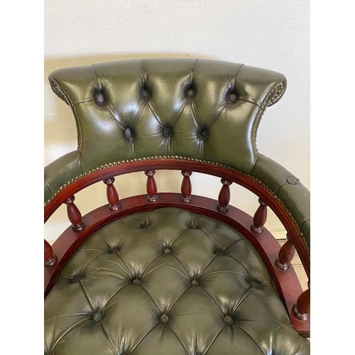 184 - A GREEN LEATHER BUTTON BACKED CAPTAINS CHAIR / DESK CHAIR, with swivel stand, and brass beaded detai... 