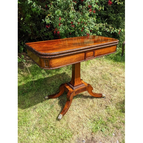 20 - A GOOD QUALITY REGENCY ROSEWOOD FOLD OVER CARD TABLE, with half circle edging detail and beaded deco... 