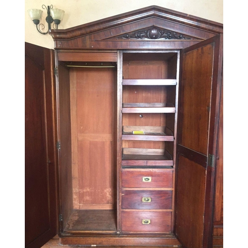 201 - A LATE 19TH CENTURY THREE DOOR MAHOGANY GENTLEMAN’S WARDROBE, with mirror, panelled doors and engrav... 