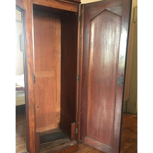 201 - A LATE 19TH CENTURY THREE DOOR MAHOGANY GENTLEMAN’S WARDROBE, with mirror, panelled doors and engrav... 