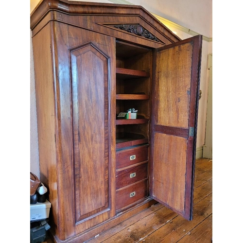 201 - A LATE 19TH CENTURY THREE DOOR MAHOGANY GENTLEMAN’S WARDROBE, with mirror, panelled doors and engrav... 