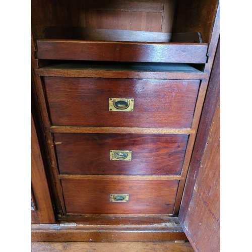 201 - A LATE 19TH CENTURY THREE DOOR MAHOGANY GENTLEMAN’S WARDROBE, with mirror, panelled doors and engrav... 