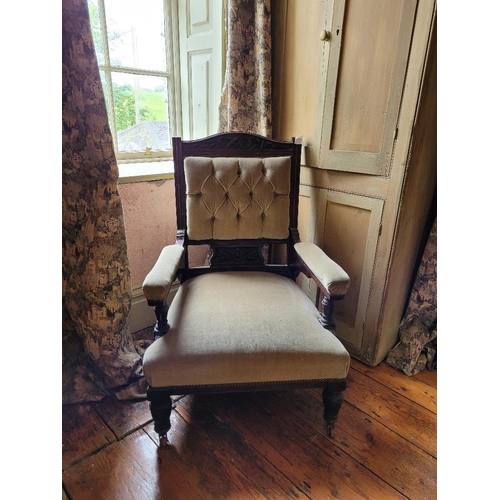 204 - A 19TH CENTURY MAHOGANY GENTLEMANS LIBRARY CHAIR, with carved crest rail over a buttoned back, padde... 