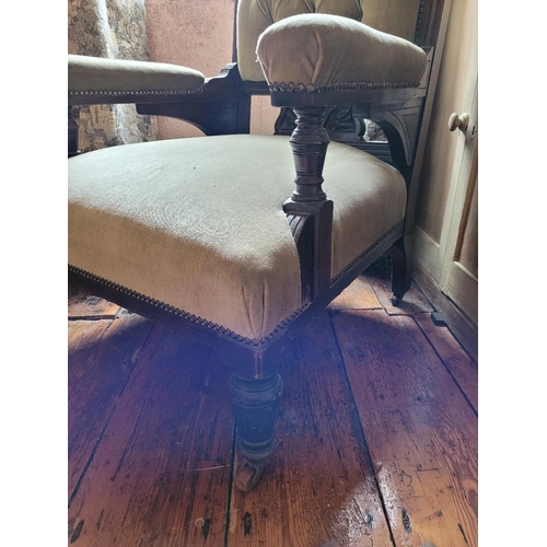 204 - A 19TH CENTURY MAHOGANY GENTLEMANS LIBRARY CHAIR, with carved crest rail over a buttoned back, padde... 