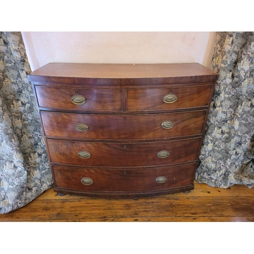 206 - A 19TH CENTURY BOW FRONTED MAHOGANY CHEST OF DRAWERS, 2 over 3, each drawer with brass swing handle ... 